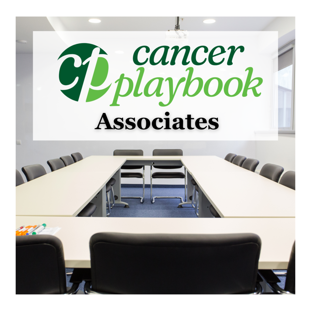 Cancer Playbook Associate written on a white board in a conference room